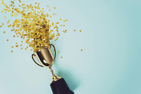 Gold cup with stars / istock - Kristina Ratobilska
